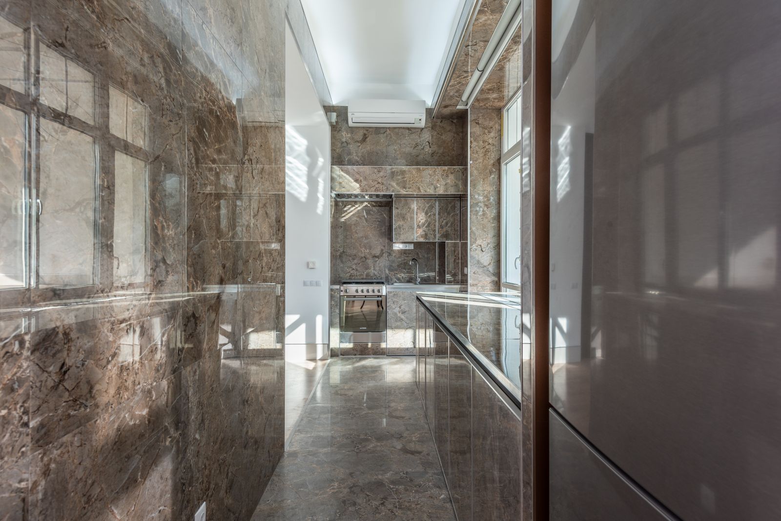 Stone tones in a tiled kitchen and floor